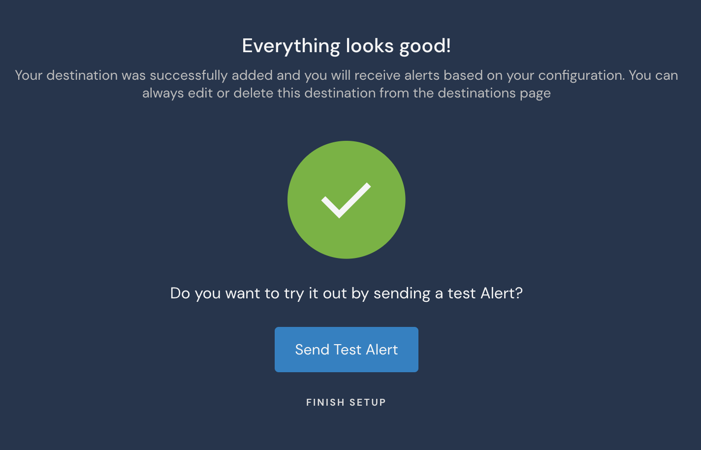 The screen displays a large green circle with a checkmark in it. A message at the top says "Everything looks good!" There is a blue button at the button labeled "Send Test Alert" and below that there is a link labeled "Finish Setup."
